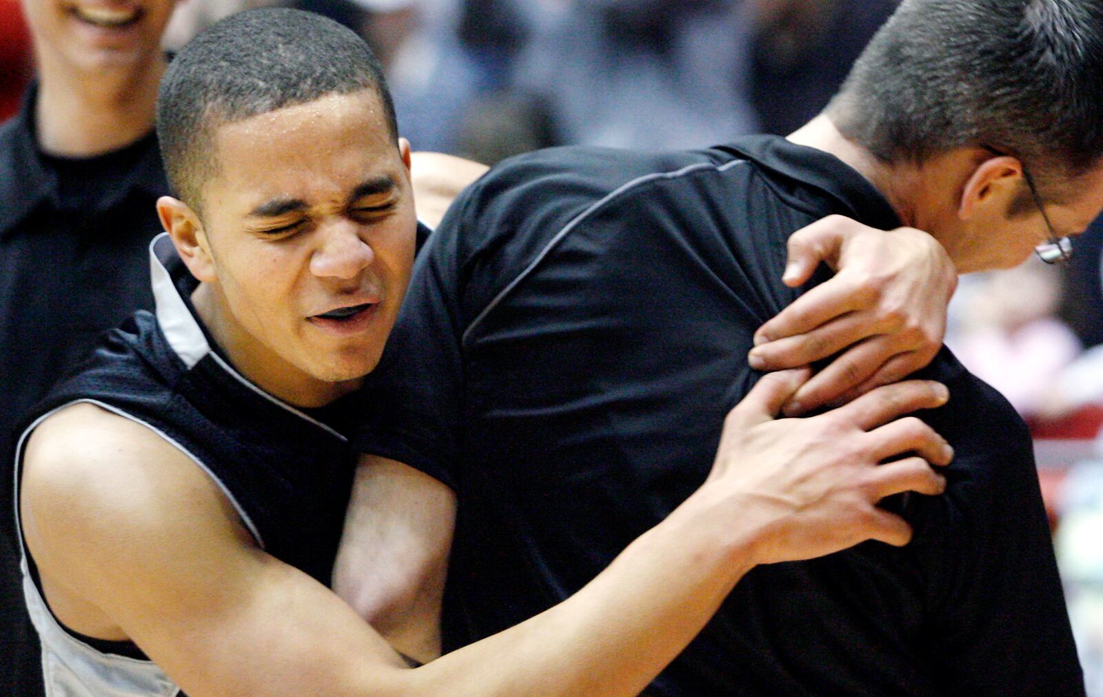 Austin Jones (21) of Graham grabs head coach Brook Cupps while celebrating a 67-61 win over Cincinnati Taft in a Div. II district final game at University of Dayton Arena on Wednesday, February 27, 2008.
Staff Photo by Barbara J. Perenic