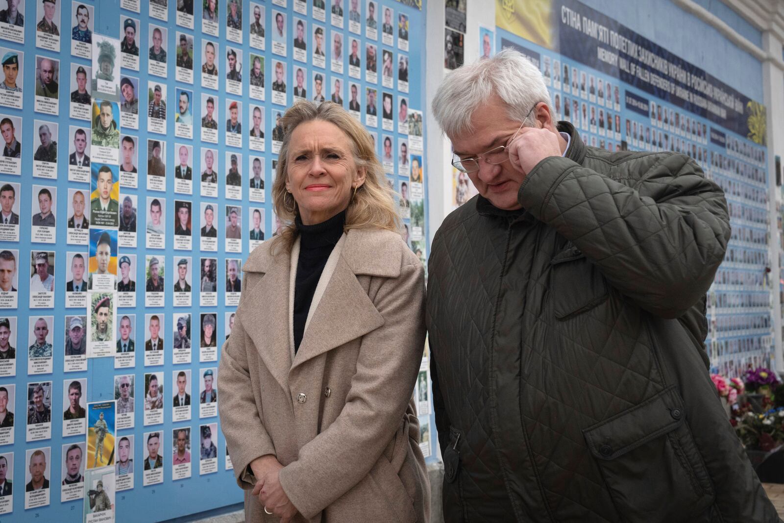 Iceland's Foreign Minister Thorgerdur Katrin Gunnarsdottir, left, and Ukraine's Foreign Minister Andriiy Sybiha attend a flower laying ceremony at the Memory Wall of Fallen Defenders of Ukraine in Kyiv, Ukraine, Tuesday, Jan. 7, 2025. (AP Photo/Efrem Lukatsky)