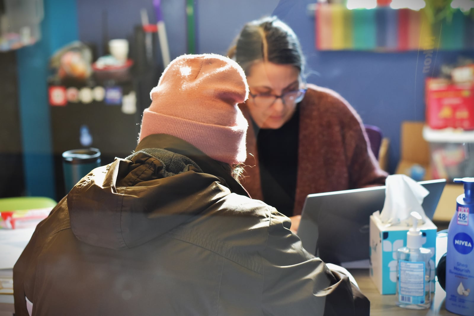 A health and safety advocate meets with a guest at the Shelter for Women and Families run by St. Vincent de Paul Society, Dayton. CORNELIUS FROLIK / STAFF