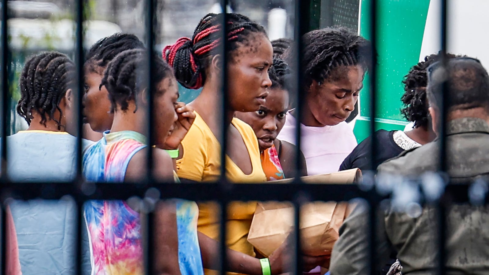 FILE - Migrants prepare to depart the U.S. Customs and Border Protection - Marathon Border Patrol Station in Marathon, Fla., June 26, 2024. A group of more than 100 migrants from Haiti arrived off Key West in a sailboat early Wednesday morning, according to the Monroe County Sheriff's Office. (Al Diaz/Miami Herald via AP, File)