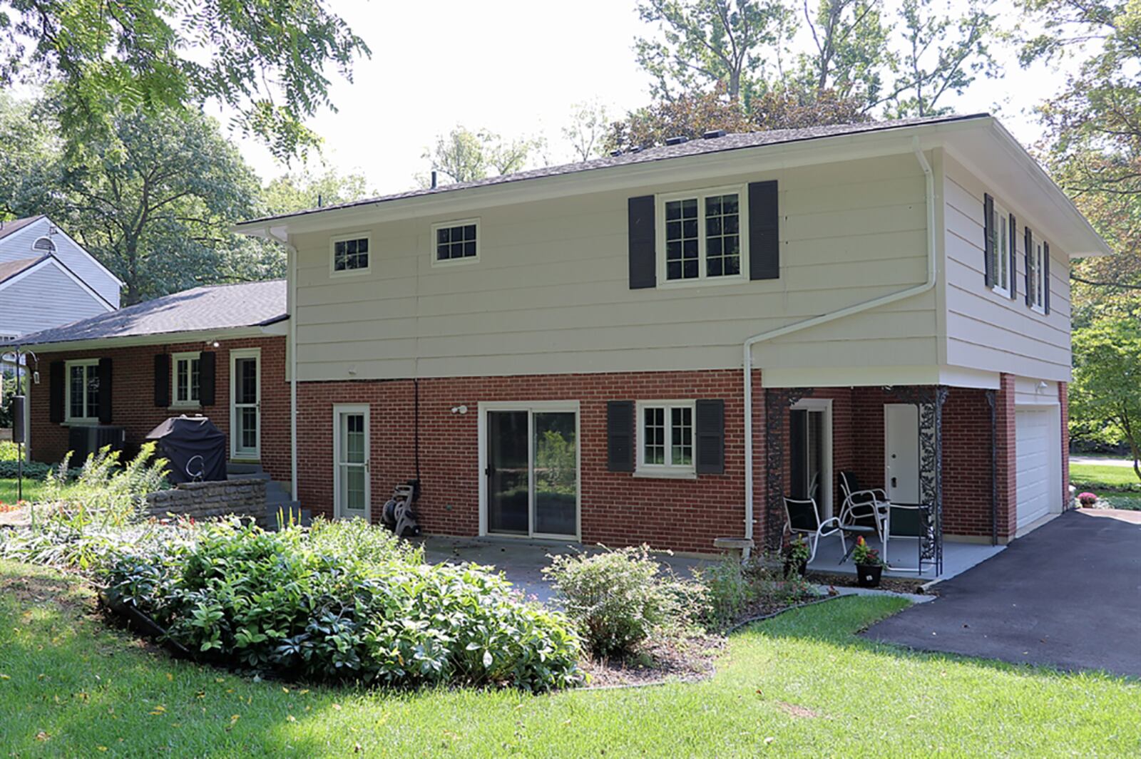 A back door opens from the kitchen to the backyard patio. A recently paved driveway offers additional parking and leads up to the 2-car, side-entry garage. CONTRIBUTED PHOTO BY KATHY TYLER