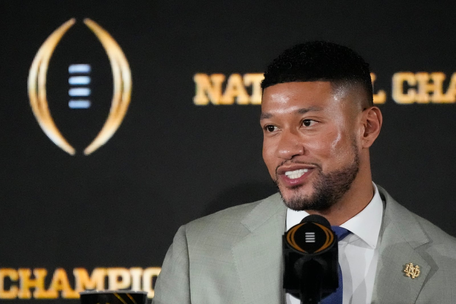 Notre Dame head coach Marcus Freeman speaks during a news conference ahead of the College Football Playoff national championship game Sunday, Jan. 19, 2025, in Atlanta. The game between Ohio State and Notre Dame will be played on Monday. (AP Photo/Chris Carlson)