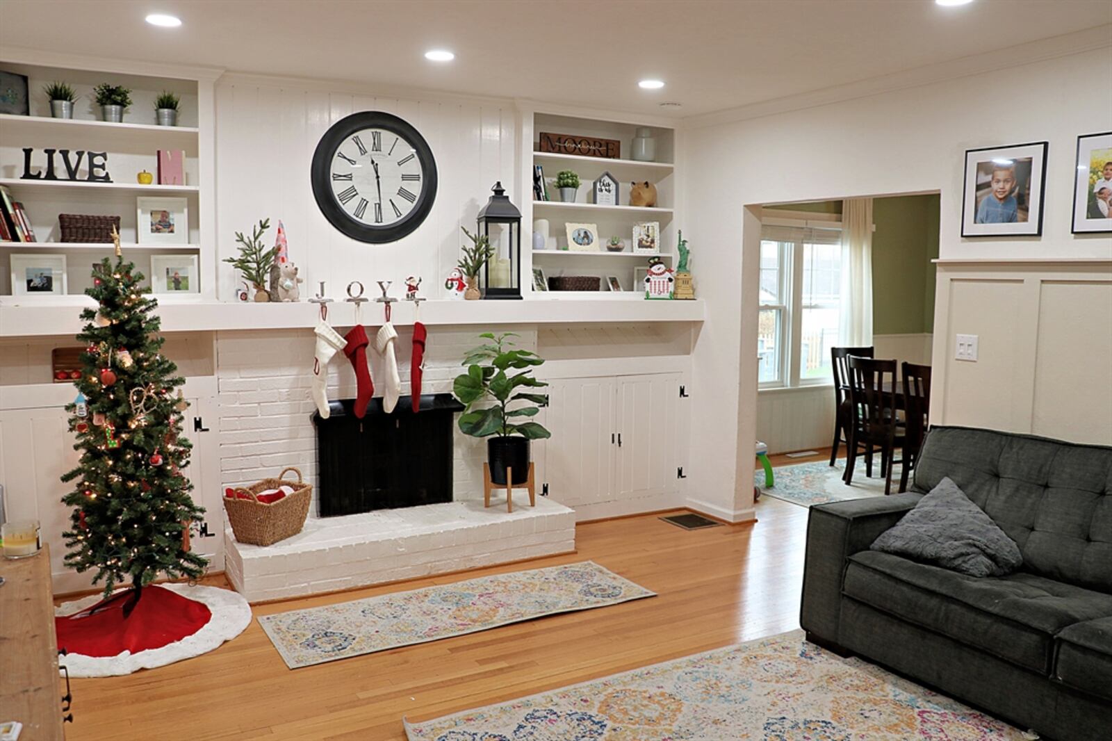 Hardwood flooring fills the living room and continues into the adjoining dining room. 