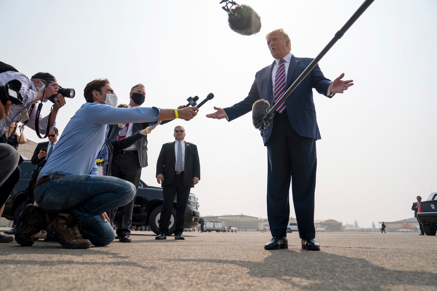 President Donald Trump speaks with reporters at Sacramento McClellan Airport in McClellan Park, Calif., Monday, Sept. 14,  2020, before attending a briefing about wildfires in California with Gov. Gavin Newsom of California, and others. (Doug Mills/The New York Times)