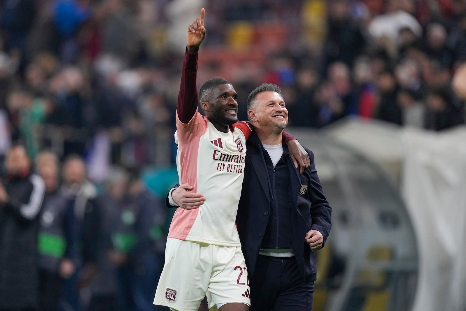 Lyon's Clinton Mata salutes fans at the end of the Europa League round of 16, first leg soccer match between FCSB and Lyon at the National Arena stadium, Thursday, March 6, 2025. (AP Photo/Andreea Alexandru)