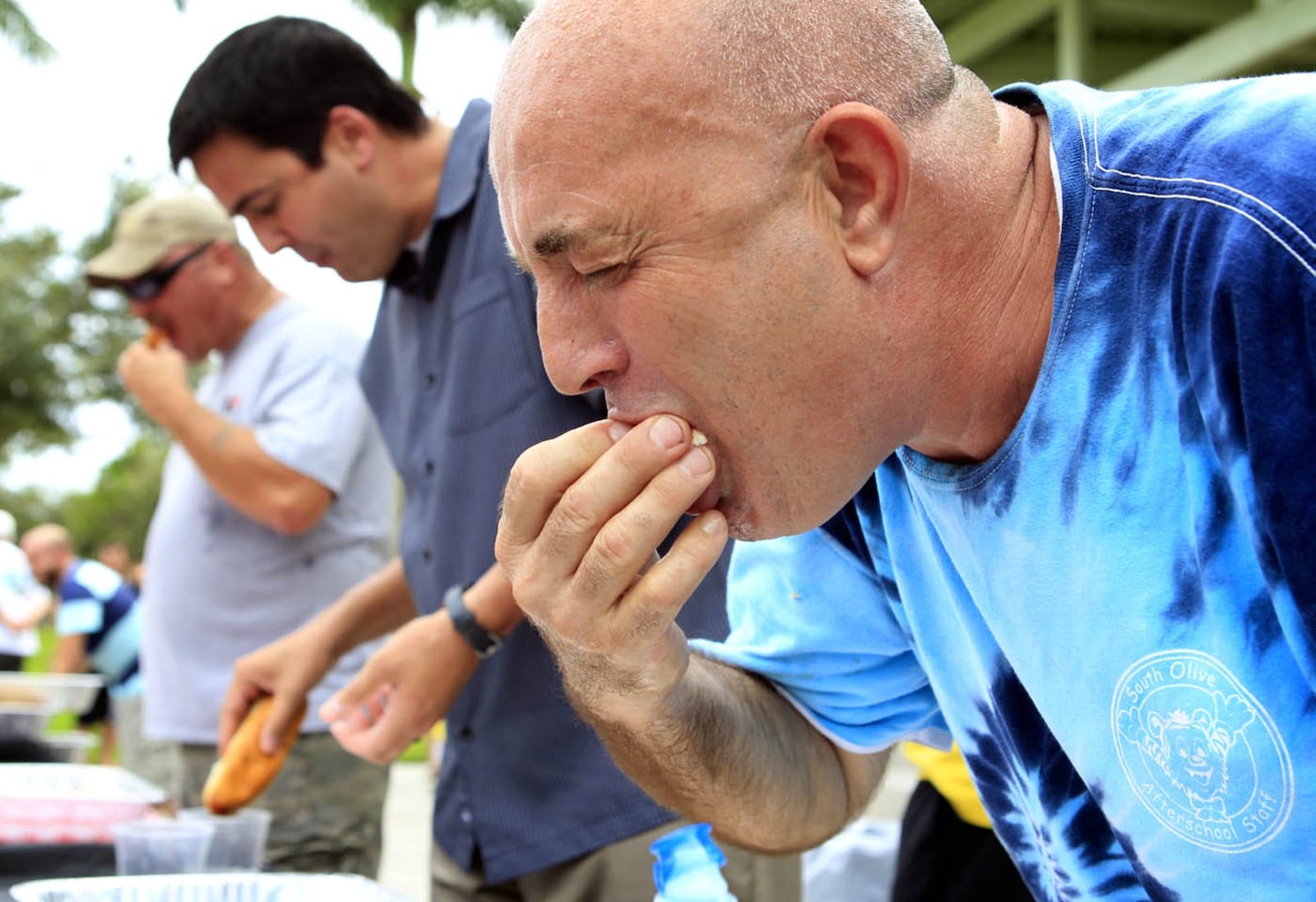 Enzo Tarantino of West Palm Beach competes in the hot dog-eating contest during the Hot Dog Fest at Abacoa Town Center in Jupiter on July 21, 2013. (Richard Graulich/The Palm Beach Post)