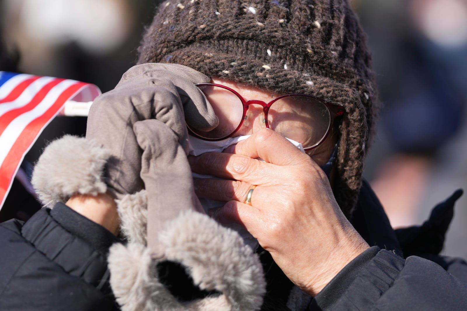 A supporter of impeached South Korean President Yoon Suk Yeol wipes tears during a rally to oppose his impeachment near the presidential residence in Seoul, South Korea, Wednesday, Jan. 15, 2025. (AP Photo/Lee Jin-man)