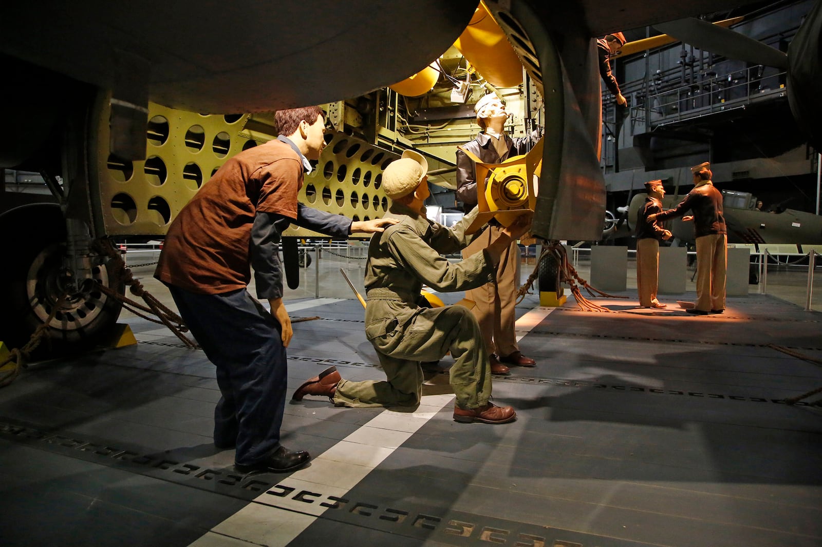 Aircrew load bombs into a B-25 aboard the USS Hornet in the Doolittle Raiders exhibit.  The National Museum of the United States Air Force will soon open the Memphis Belle exhibit, a crown jewel of the World War II Galllery.   TY GREENLEES / STAFF