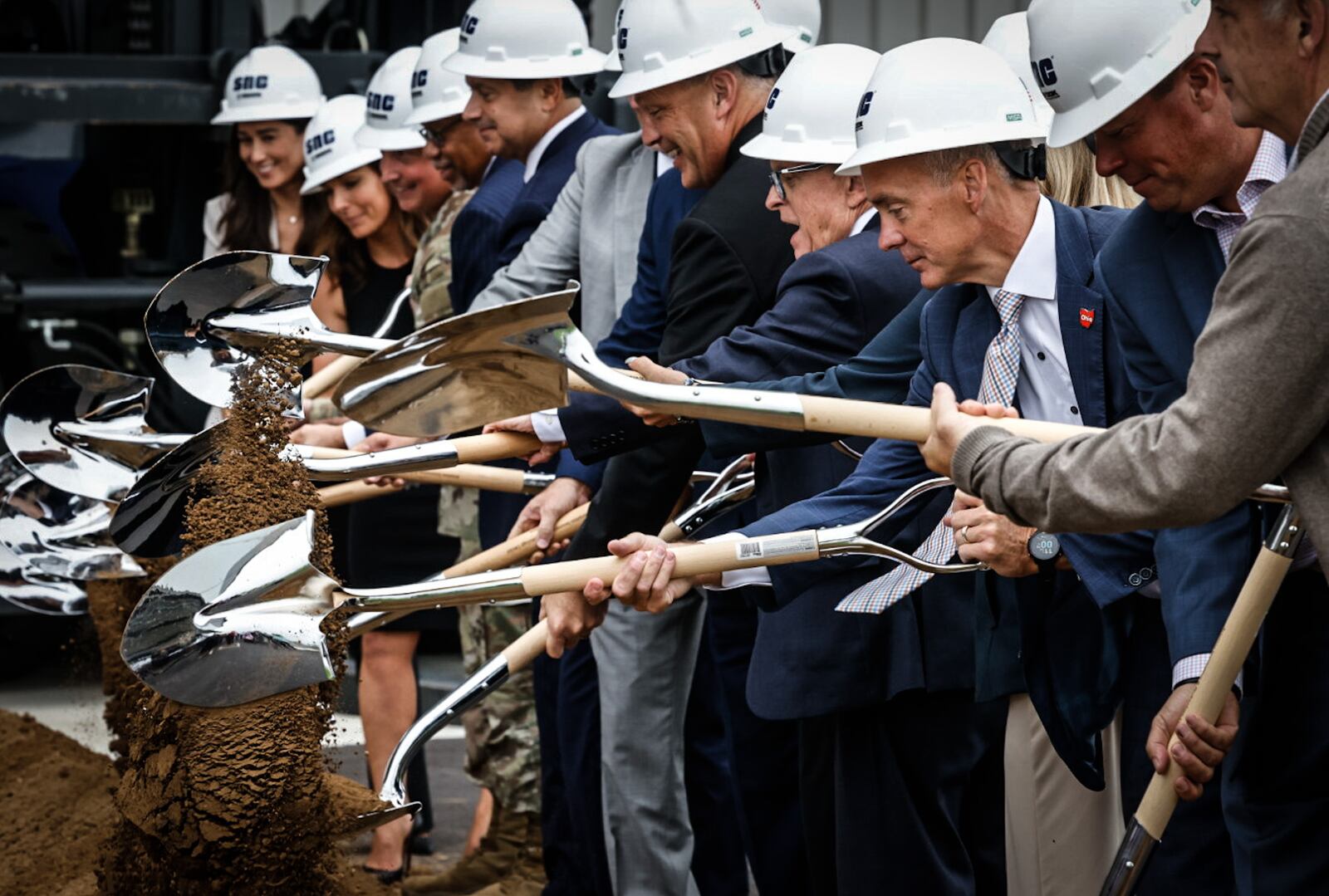 Sierra Nevada Corp. celebrated the opening of it's new 100,000-square-foot aircraft maintenance hanger and the groundbreaking of two other slightly larger hangers that will be built near the Dayton International Airport.  JIM NOELKER/STAFF