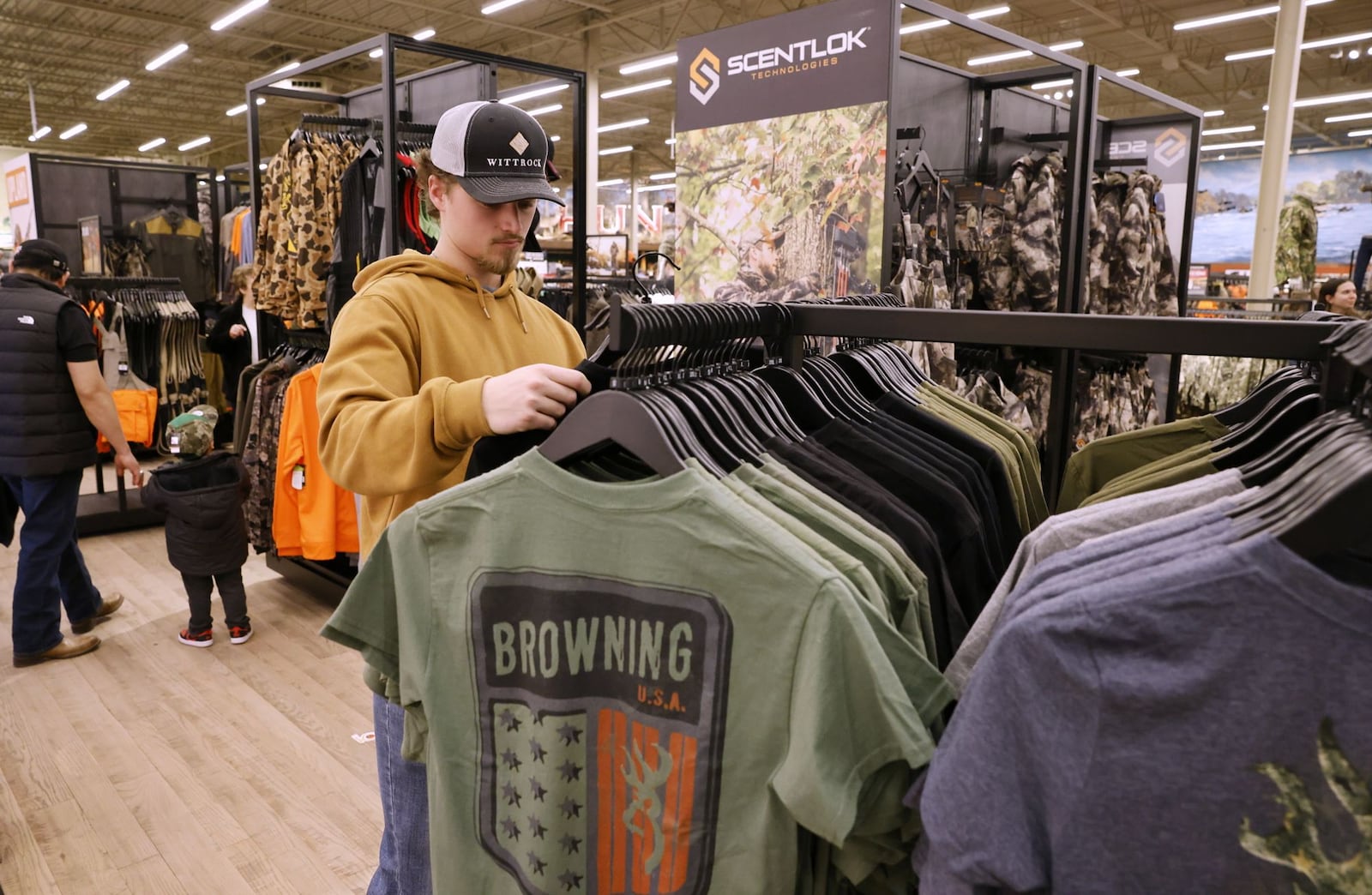 Nick Wittrock shops during the grand opening of Bass Pro Shops Wednesday, Feb. 21, 2024 in West Chester Township. NICK GRAHAM/STAFF