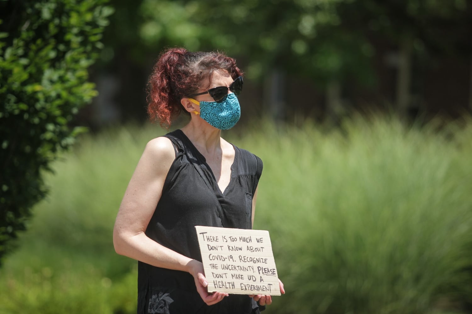 PHOTOS: Professors at the University of Dayton hold demonstration about school opening