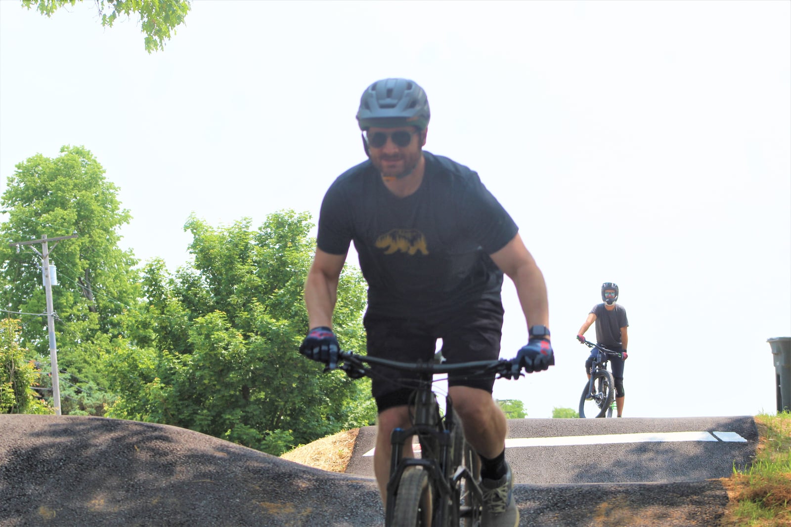 Dan McIntyre, 42, of Middletown, and Brandon Botschner, 39, of Oakwood, ride the tracks at the Dayton Bike Yard on May 18, 2023. CORNELIUS FROLIK / STAFF