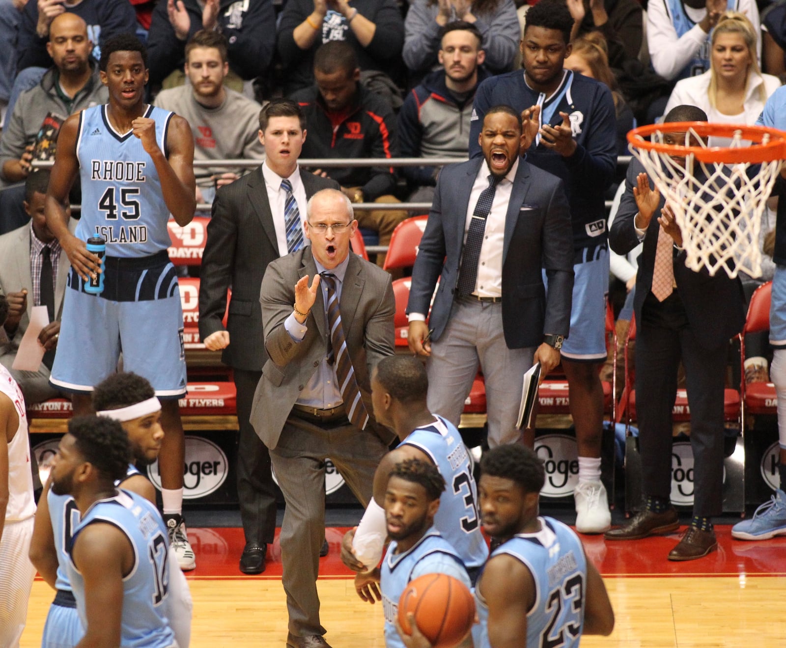 Rhode Island coach Dan Hurley claps after a stop by his team against Dayton in the first half. DAVID JABLONSKI / STAFF