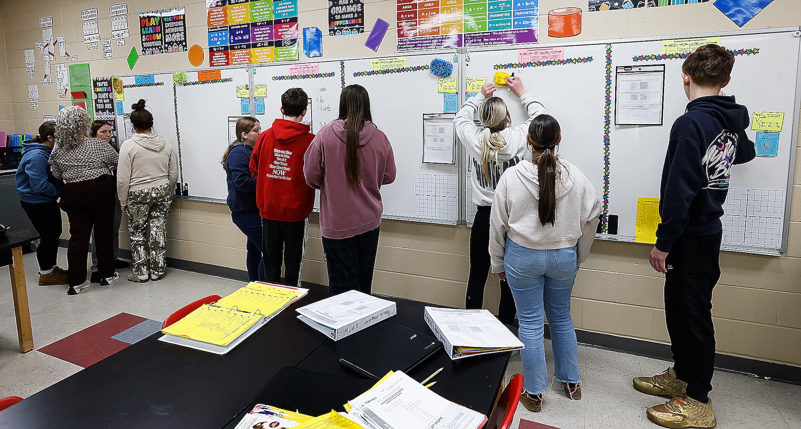 New Lebanon eighth-grade math teacher Ronda Nisbet works with her students during a math class.  MARSHALL GORBY\STAFF