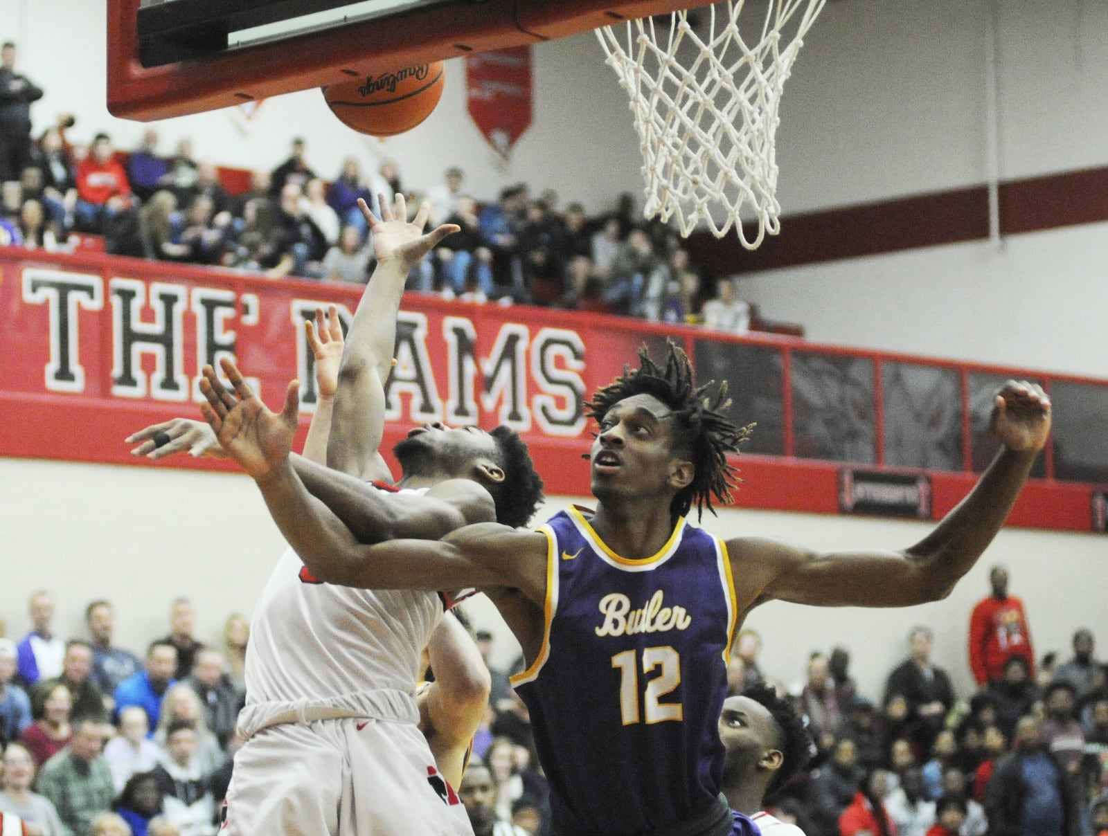 Bryant Johnson of Butler (12) confronts Trotwood-Madison’s Sammy Anderson.Trotwood defeated visiting Butler 94-76 in a boys high school basketball game on Friday, Jan. 11, 2019. MARC PENDLETON / STAFF