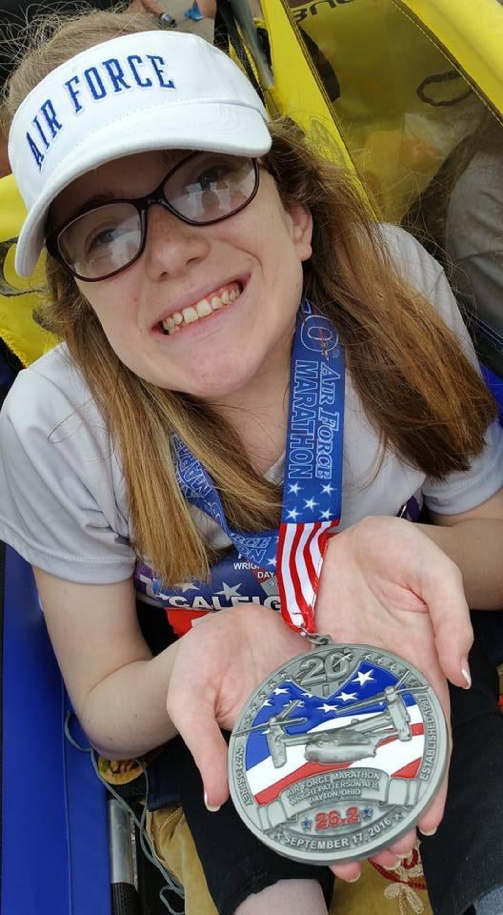 Caleigh Hildebrandt poses with her US Air Force Marathon medal after completing the 2016 race. CONTRIBUTED