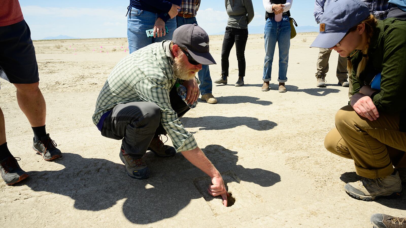 Daron Duke, Far Western Anthropological Research Group, shows visitors footprints discovered on an archaeological site on the Utah Test and Training Range on July 18. U.S. AIR FORCE PHOTO/R. NIAL BRADSHAW