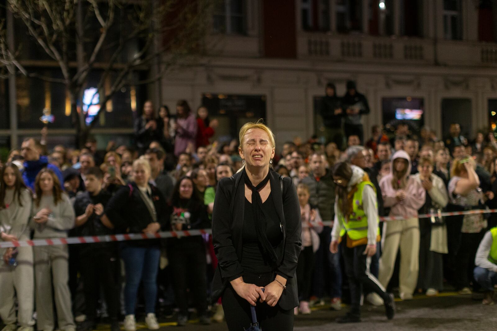 Dijana Hrka, center, mother of a young man killed in a train station canopy collapse, cries as she attends a protest ahead of a major anti-corruption rally this weekend, in Belgrade, Serbia, Friday, March 14, 2025. (AP Photo/Marko Drobnjakovic)