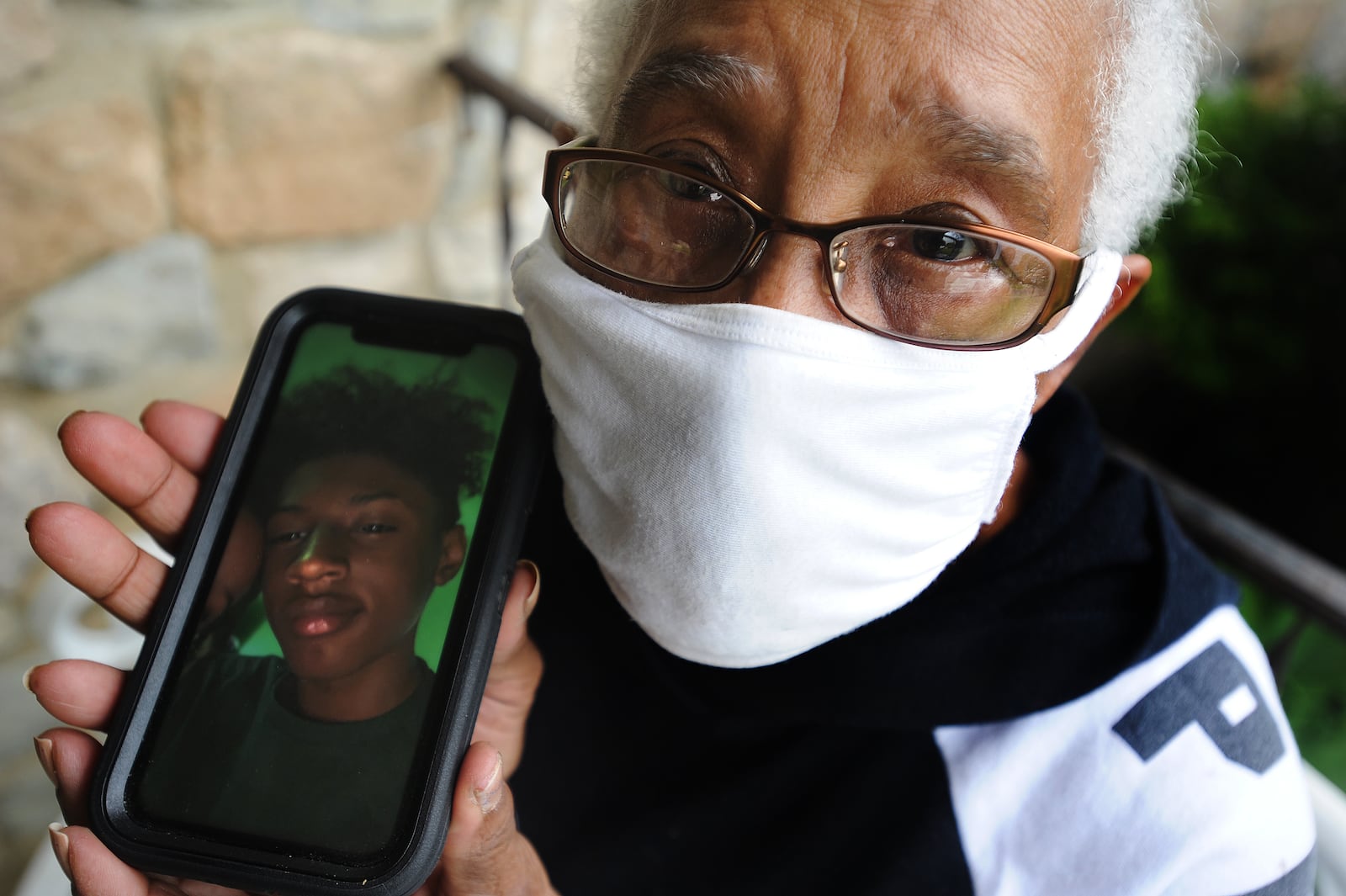 Mary Jo Cook, 15-year-old J’Yon Kolby-Lee Manson-Coleman's great grandmother, holds a photo of her grandson who was recently shot and killed in Harrison Twp. Cook says the violence among young people is out of control and is calling for them to spend their time accomplishing something positive and productive.  MARSHALL GORBY\STAFF