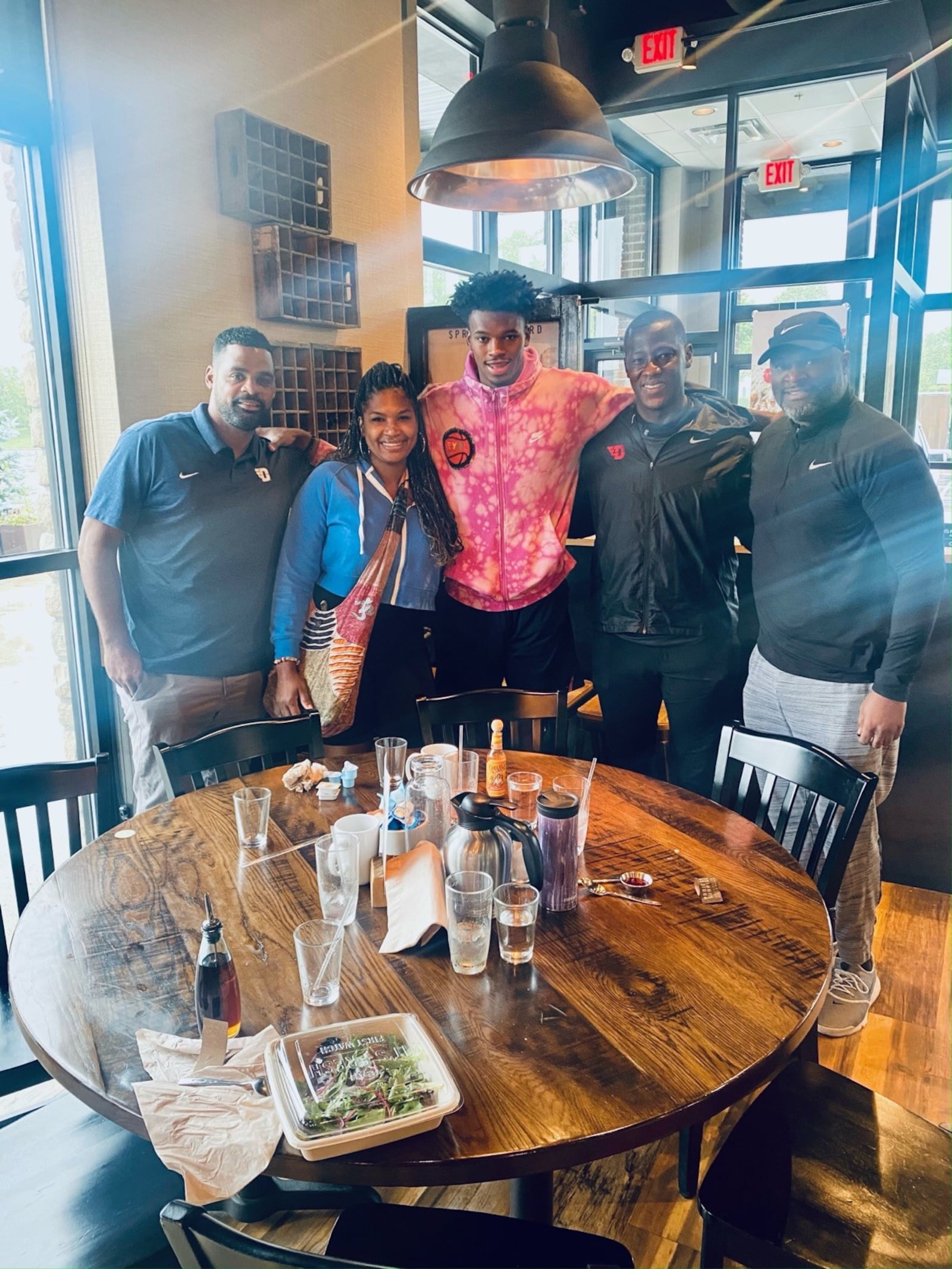 From left: UD assistant  coach Ricardo Greer, Tomika Holmes, DaRon II, UD head coach Anthony Grant  and DaRon Holmes Sr. CONTRIBUTED