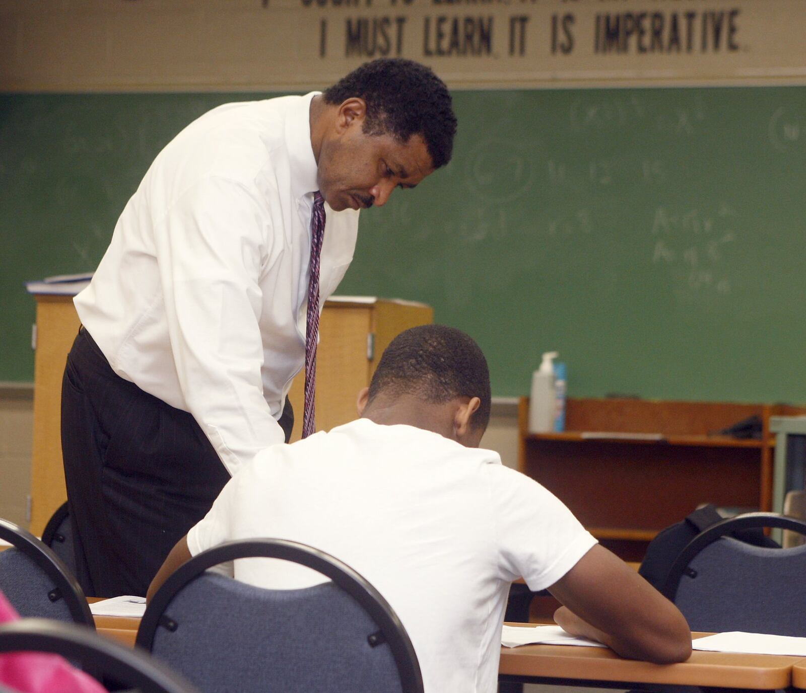 Richard Gates, superintendent of Jefferson Twp. schools, works with a student. FILE PHOTO