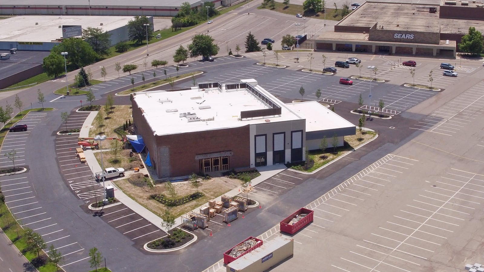 Construction of a new Outback Steakhouse at the Dayton Mall has transformed the former Sears Automotive Center in to a modern looking building that will also include retail space.   TY GREENLEES / STAFF