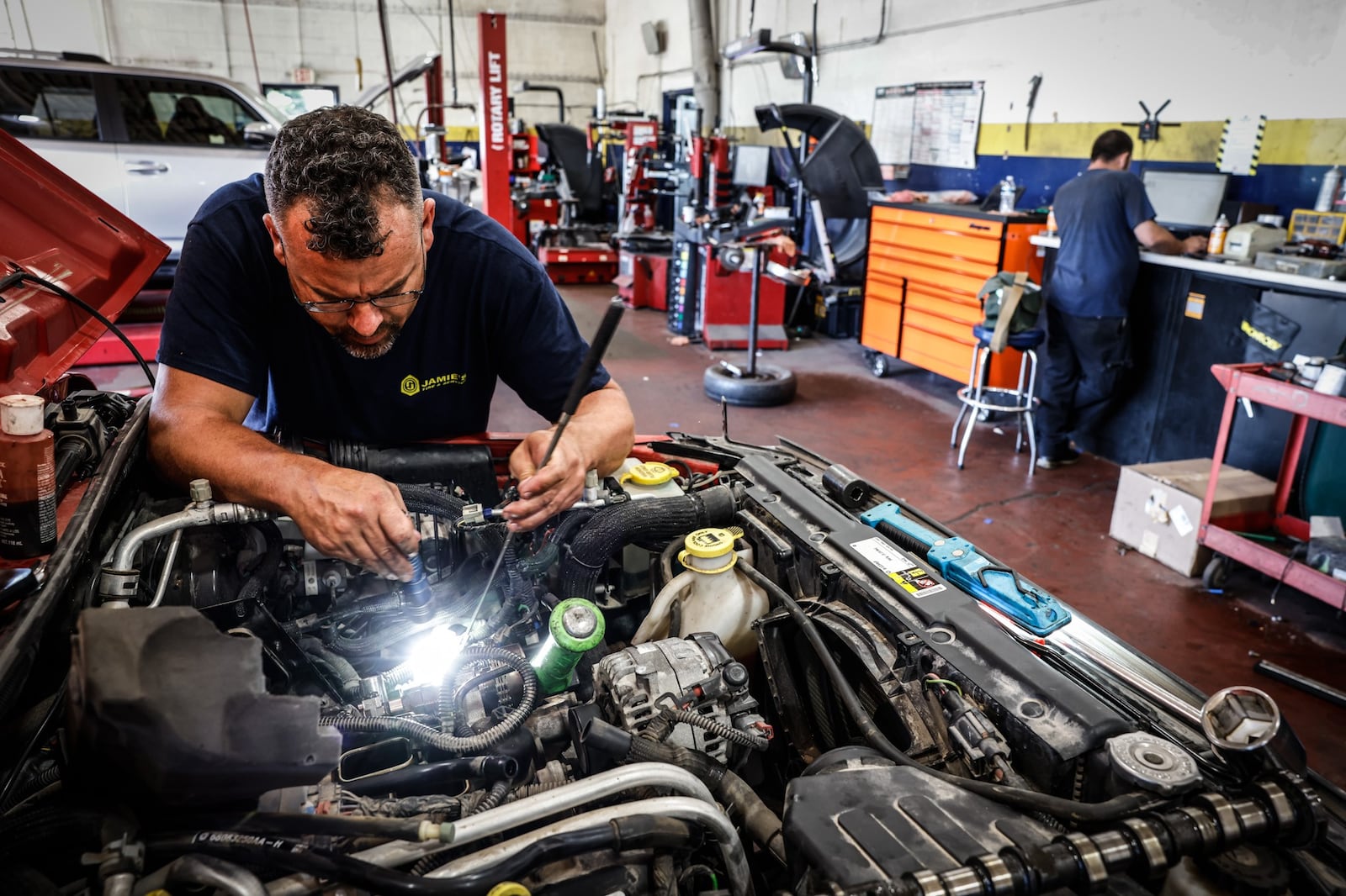 Jamie's Tire & Service manager, Rob Leach, works on Jeep Friday afternoon June 24, 2022. The business will participate in Wednesday's summer job fair at Wright State University's Nutter Center. JIM NOELKER/STAFF