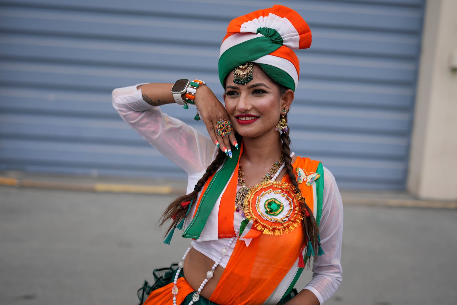 An Indian arrives to watch the ICC Champions Trophy final cricket match between India and New Zealand at Dubai International Cricket Stadium in Dubai, United Arab Emirates, Sunday, March 9, 2025. (AP Photo/Altaf Qadri)