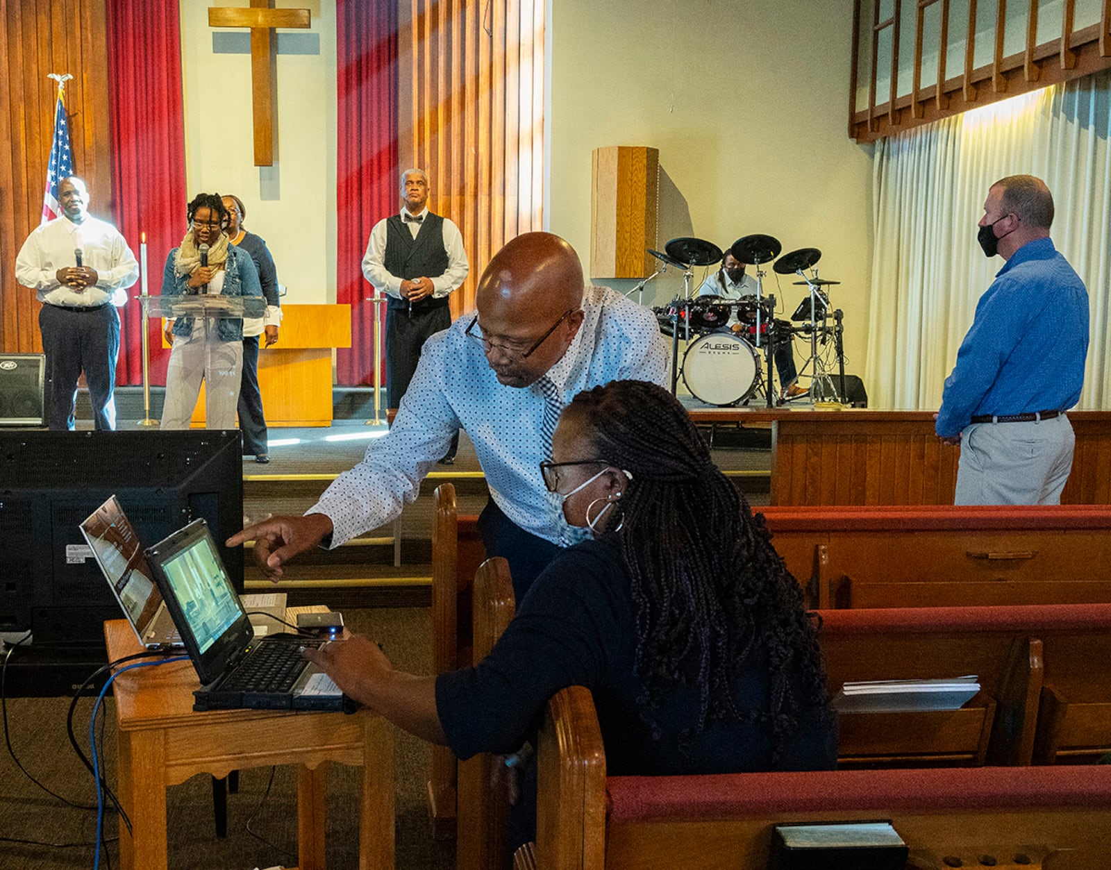 Brandi and Bryant Gillespie monitor the Protestant service video recording Feb. 27 in Kittyhawk Chapel at Wright-Patterson Air Force Base. Since the chapel does not have Wi-Fi, a cellphone is used to stream the service, but a backup is recorded to ensure content in case there is a connection issue. U.S. AIR FORCE PHOTO/R.J. ORIEZ