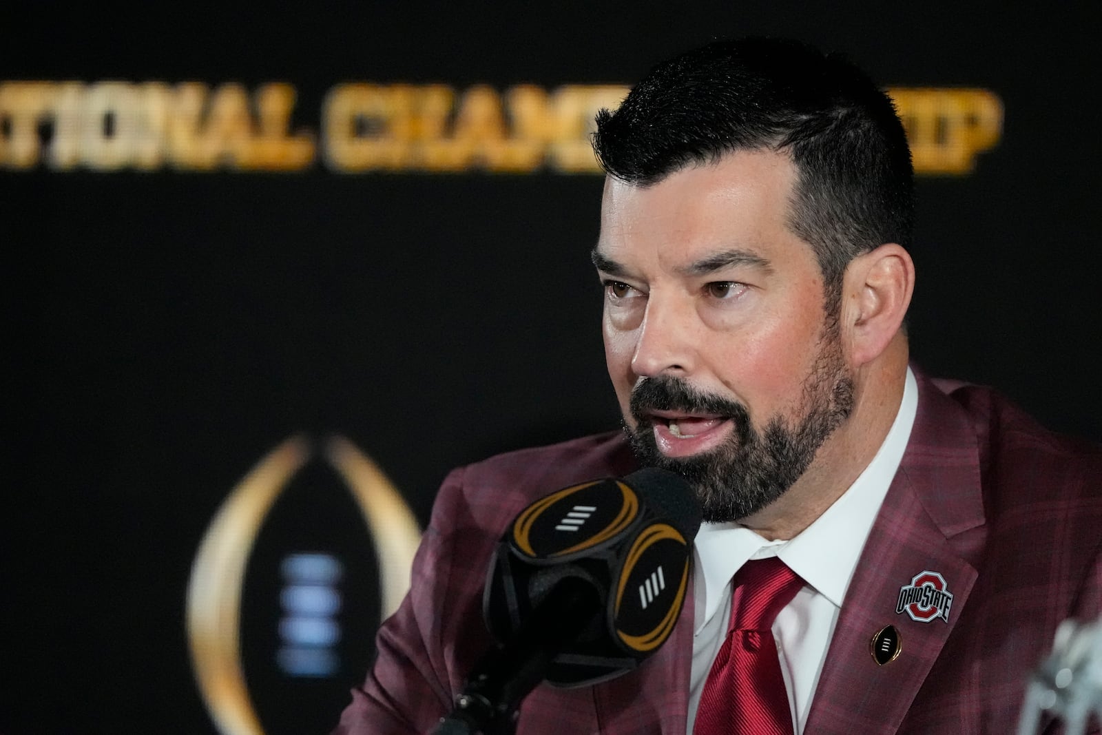 Ohio State head coach Ryan Day speaks during a news conference ahead of the College Football Playoff national championship game Sunday, Jan. 19, 2025, in Atlanta. The game between Ohio State and Notre Dame will be played on Monday. (AP Photo/Chris Carlson)