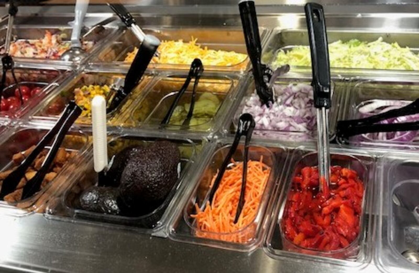 The condiment bar at Flyby BBQ at the Mall at Fairfield Commons in Beavercreek, which is reopening its dining room today, June 1, 2020