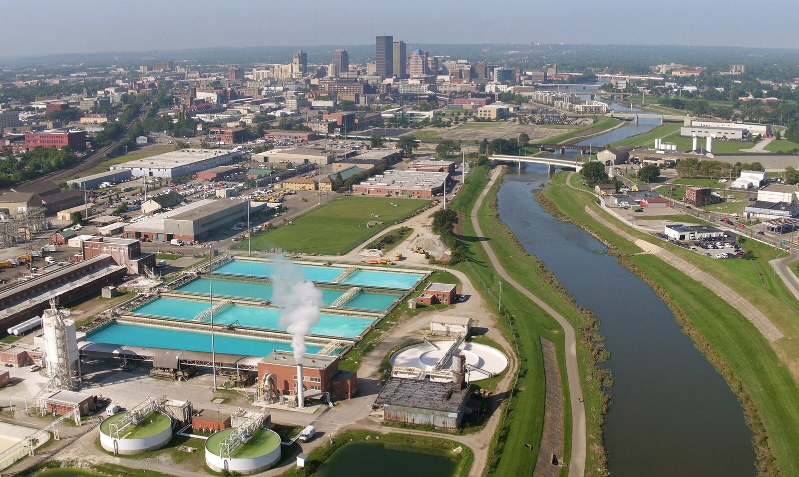 The Mad River flows past the city of Dayton’s Ottawa water treatment plant on the east side of Dayton. TY GREENLEES / STAFF