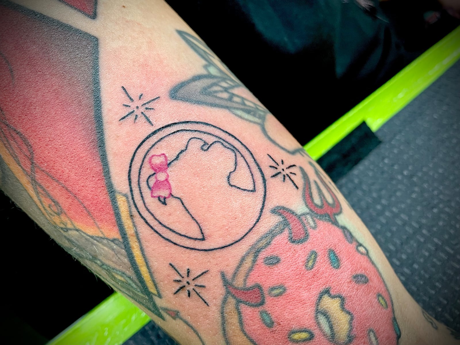 Harley Wilson's tattoo of The Food Pitt's logo features a pink bow on the pit bull's ear. NATALIE JONES/STAFF