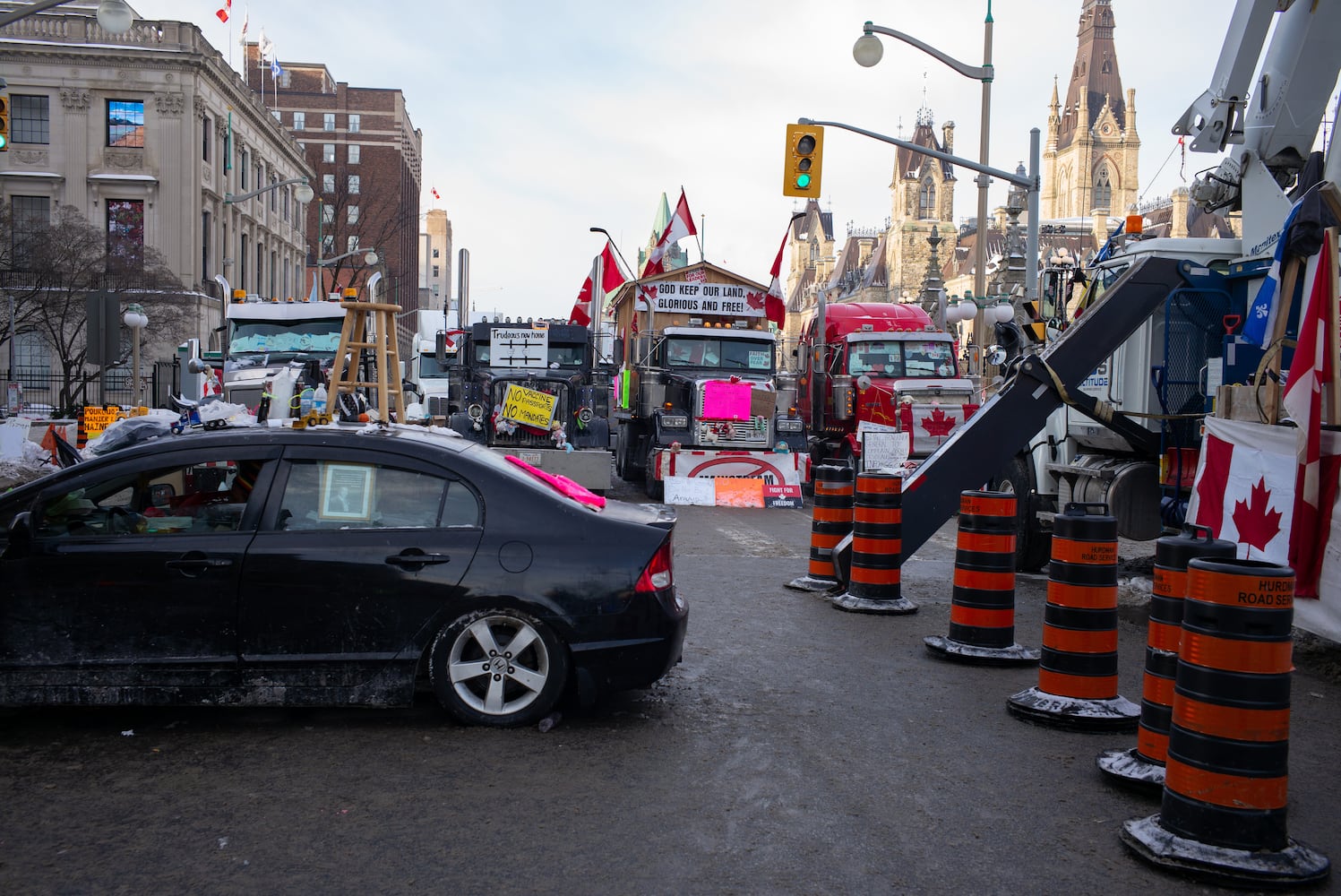 Heavy trucks and other vehicles parked outside of Parliament in Ottawa, Ontario, on Monday morning, Feb. 76, 2022, in Canada. (Ian Austen/The New York Times)