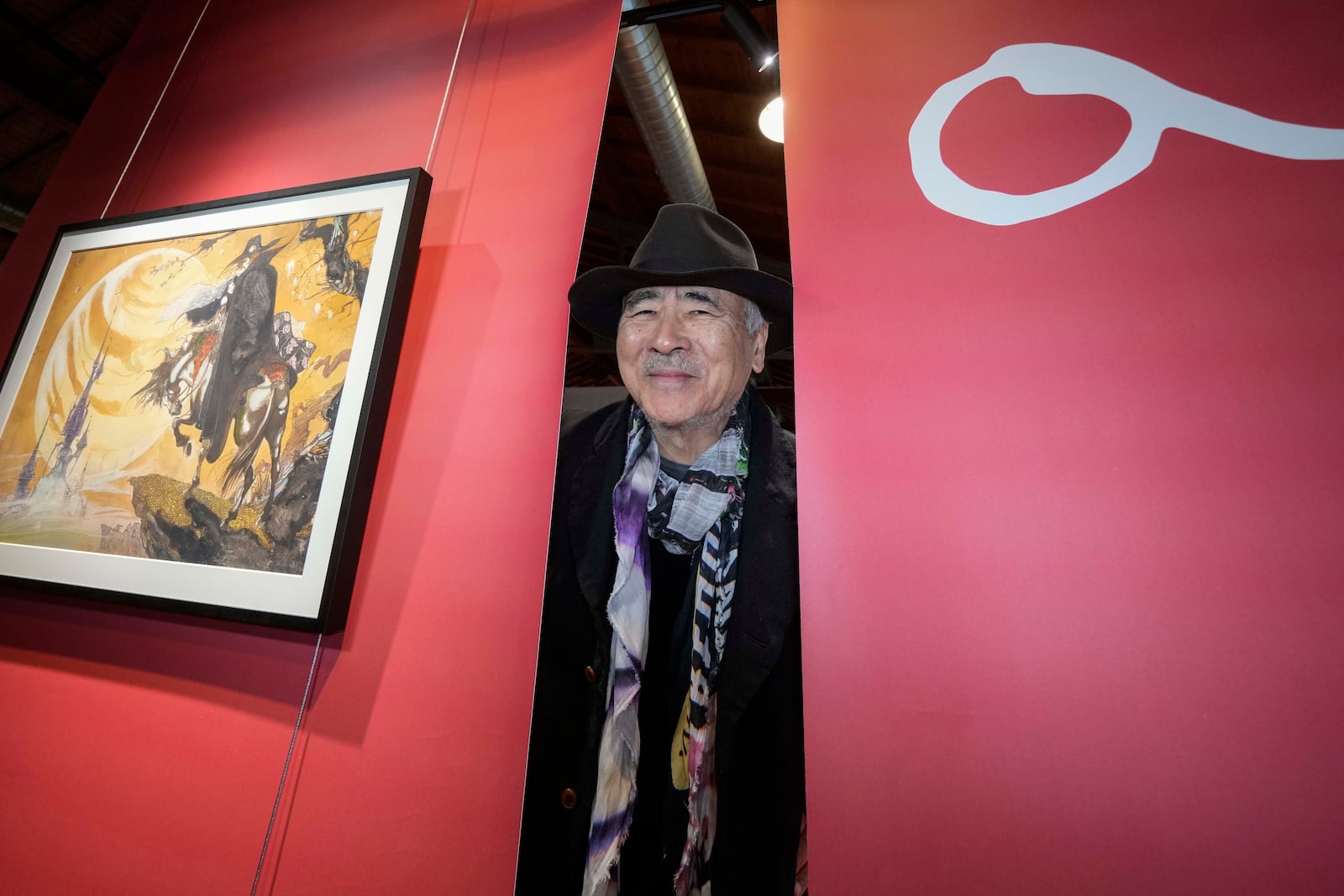 Artist Yoshitaka Amano poses during the press preview of the exhibition "Amano Corpus Animae", celebrating his 50-year-long career, at the Fabbrica del Vapore, in Milan, Italy, Tuesday, Nov. 12, 2024. (AP Photo/Luca Bruno)