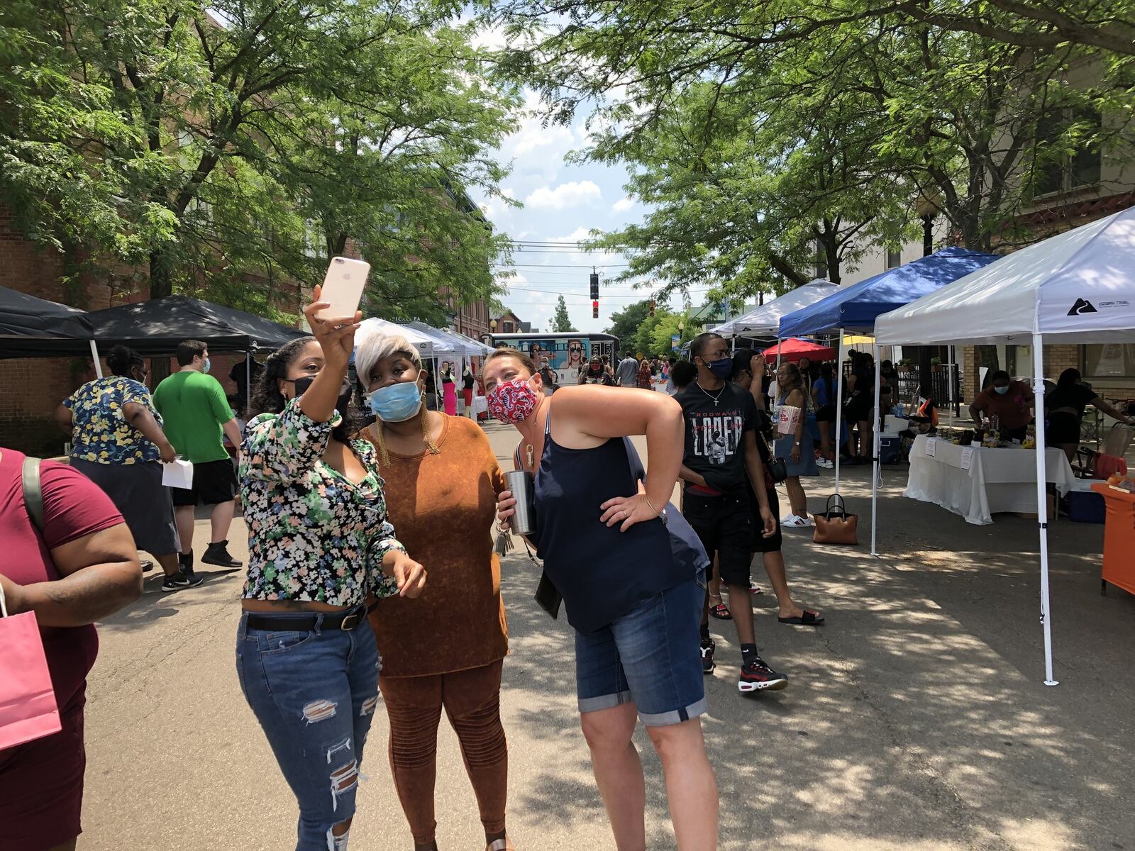 The Wright Dunbar Day block party was held on Sunday, July 5, in Dayton’s Wright Dunbar neighborhood. It was organized by Dayton businesswoman Tae Winston (center), who owns The Entrepreneurs Marketplace and The Entrepreneurs Shoppe, both located in the neighborhood. LYNN HULSEY/Staff Photo