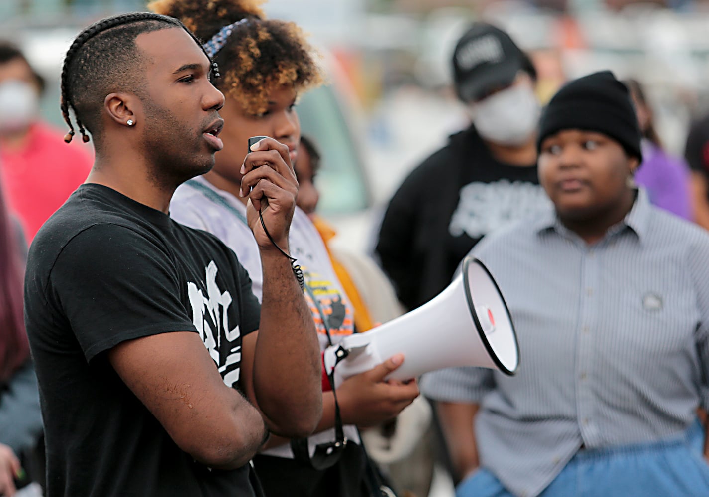 PHOTOS: Demonstrators rally for justice in Beavercreek