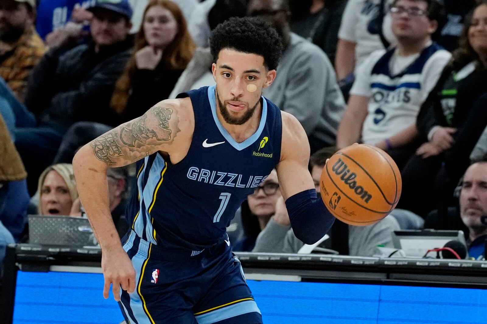 Memphis Grizzlies guard Scotty Pippen Jr. steals the ball from the Minnesota Timberwolves and heads up court in the second quarter of an NBA basketball game Saturday, Jan. 11, 2025, in Minneapolis. (AP Photo/Bruce Kluckhohn)