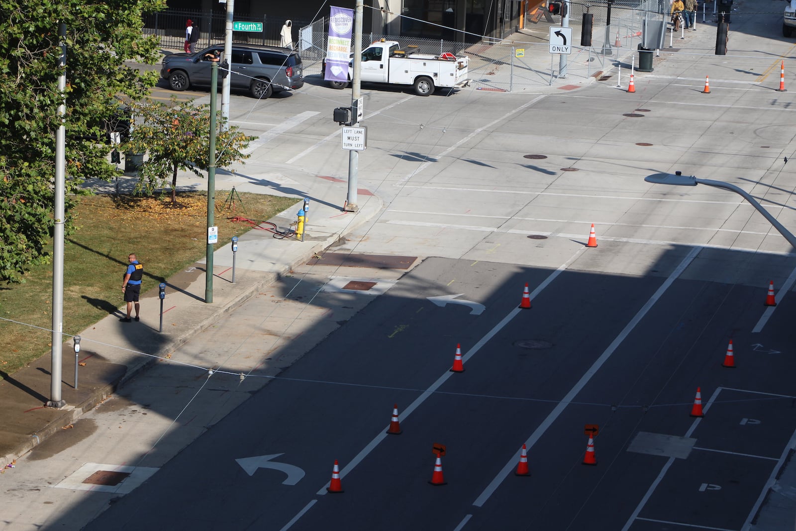 A Dayton police officer on South Jefferson Street in downtown Dayton on Sept. 20, 2023. Two people were shot in the area on Tuesday. CORNELIUS FROLIK / STAFF