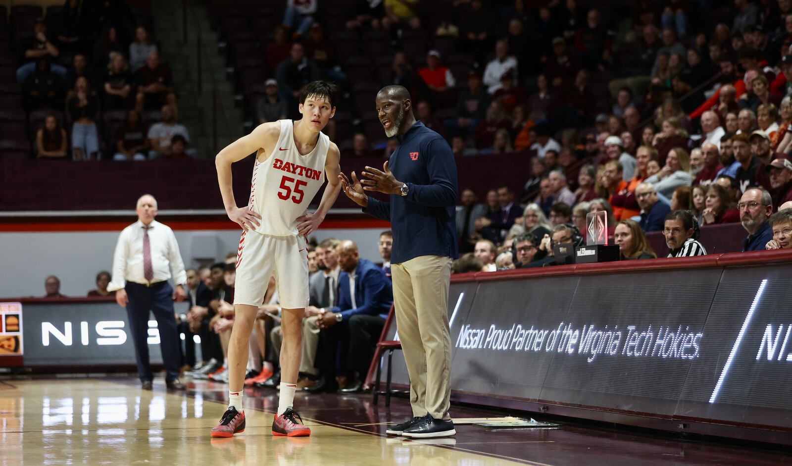 Dayton's Anthony Grant talks to Mike Sharavjamts during a game against Virginia Tech on Wednesday, Dec. 7, 2022, at Cassell Coliseum in Blacksburg, Va. David Jablonski/Staff