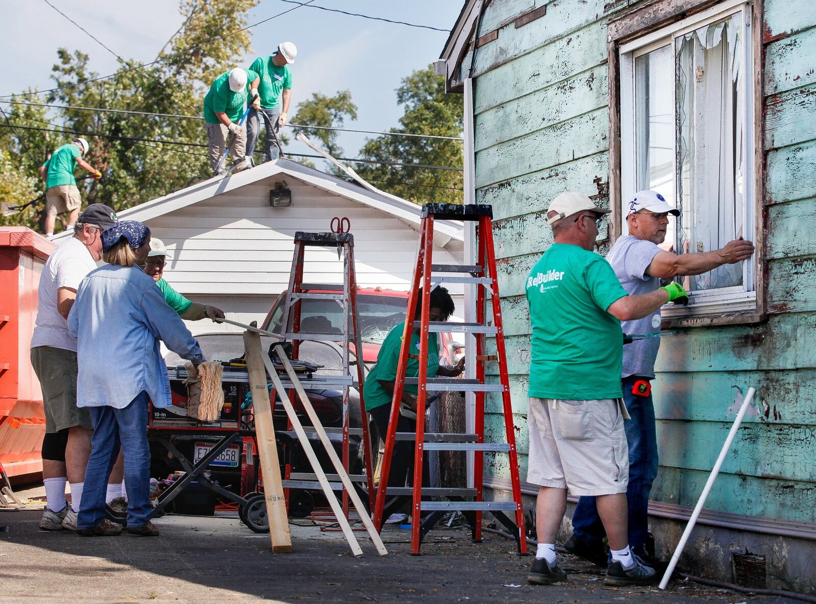 Volunteers from Shiloh Church work Thursday, Sept. 19, 2019, to help Jessica Brady’s house in Harrison Twp. The rebuilding project is the first tornado-damaged home to be repaired through a partnership of non-profit organizations formed following the Memorial Day natural disaster. CHRIS STEWART / STAFF