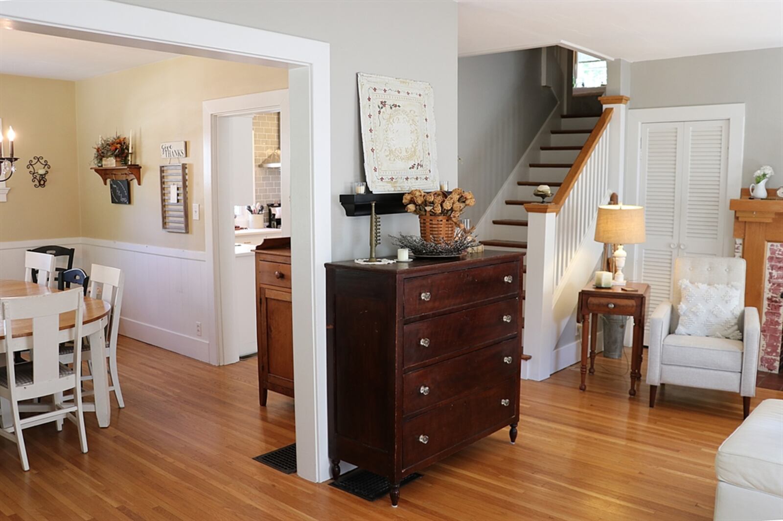 Inside, the house has refinished hardwood flooring — including the open staircase and dining and living rooms. 