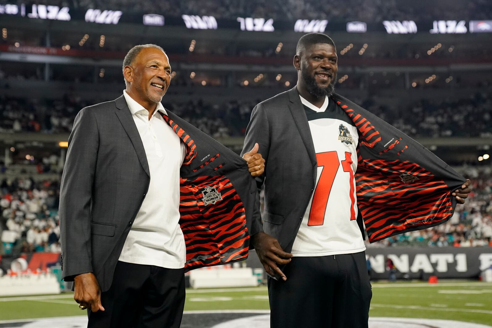 Former Cincinnati Bengals' Isaac Curtis and Willie Anderson were inducted into the Ring of Honor during the halftime of an NFL football game between the Cincinnati Bengals and the Miami Dolphins, Thursday, Sept. 29, 2022, in Cincinnati. (AP Photo/Joshua A. Bickel)