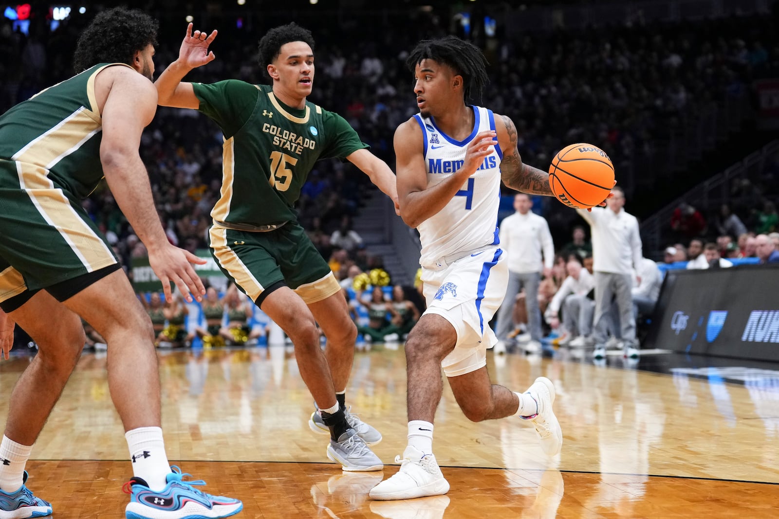 Memphis guard PJ Haggerty (4) drives against Colorado State guard Jalen Lake (15) during the second half in the first round of the NCAA college basketball tournament, Friday, March 21, 2025 in Seattle. (AP Photo/Lindsey Wasson)