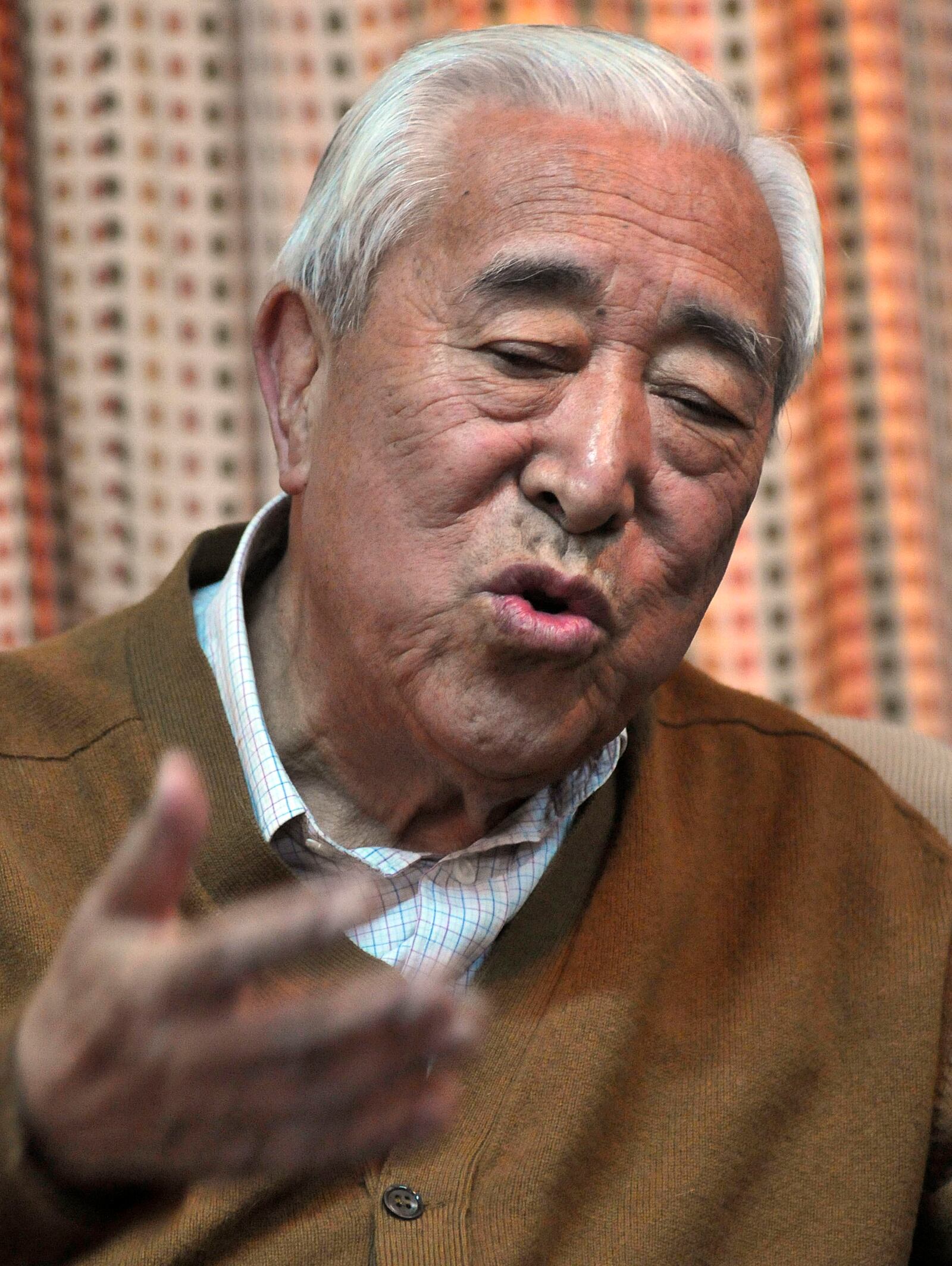 FILE - Gyalo Thondup, elder brother of the Dalai Lama, speaks to media in Dharamshala, India, Nov. 19, 2008. (AP Photo/Ashwini Bhatia, File)