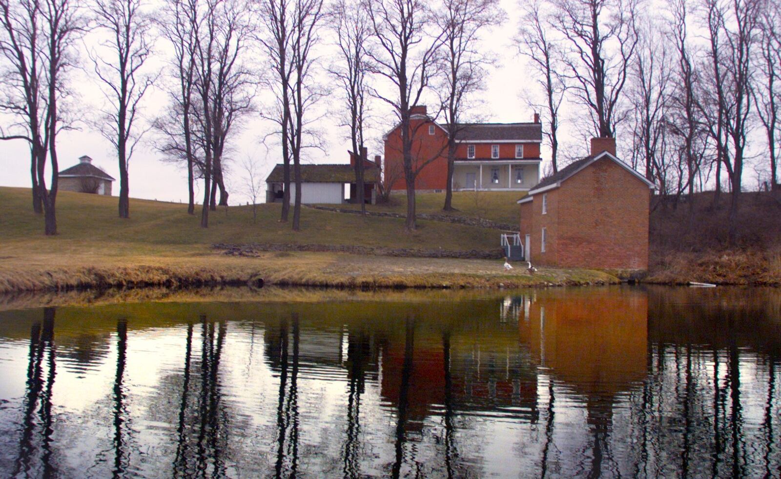 A view of the Johnston Farm farmhouse and spring and springhouse in Piqua. DAYTON DAILY NEWS ARCHIVES