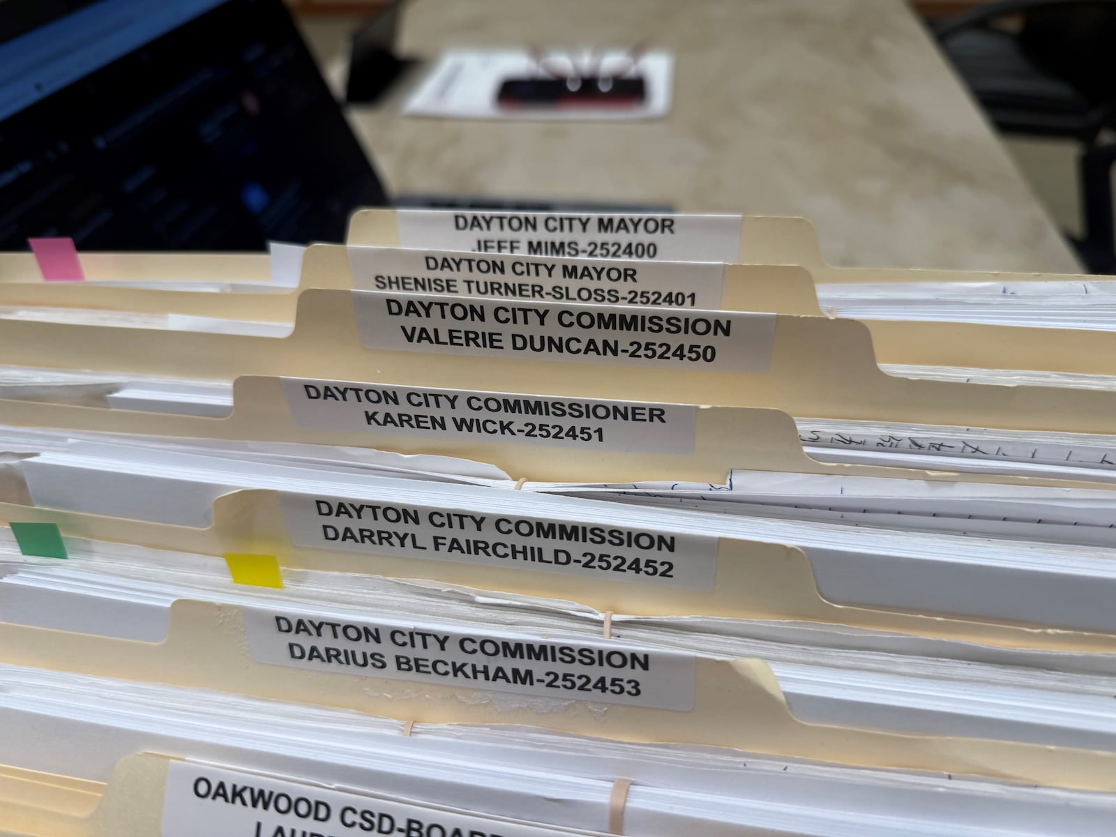 Folders containing candidate petitions for the Dayton City Commission and mayor's races at the Montgomery County Board of Elections. CORNELIUS FROLIK / STAFF