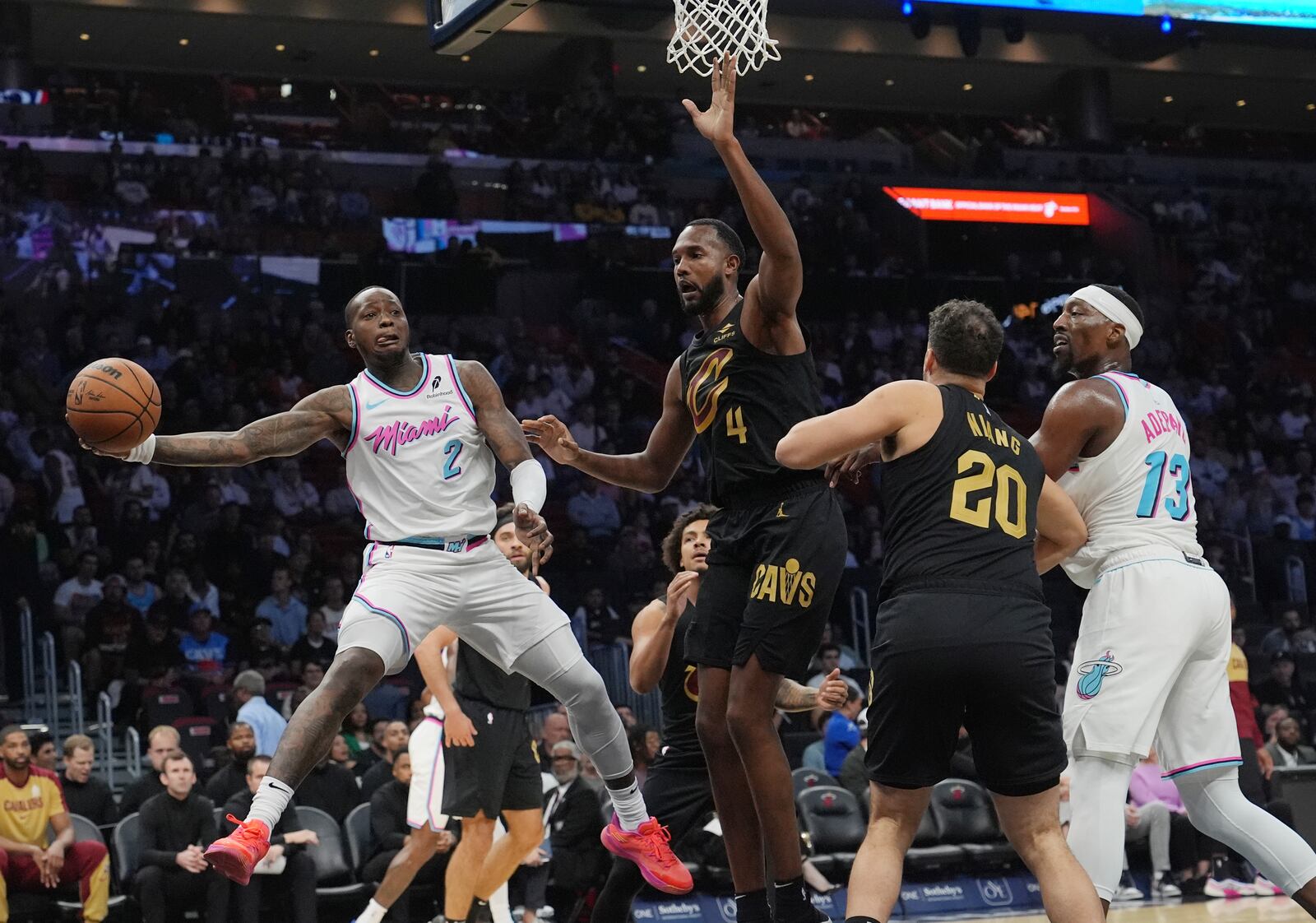 Miami Heat guard Terry Rozier (2) looks to pass as Cleveland Cavaliers forward Evan Mobley (4) defends during the first half of an NBA basketball game, Wednesday, Jan. 29, 2025, in Miami. (AP Photo/Lynne Sladky)