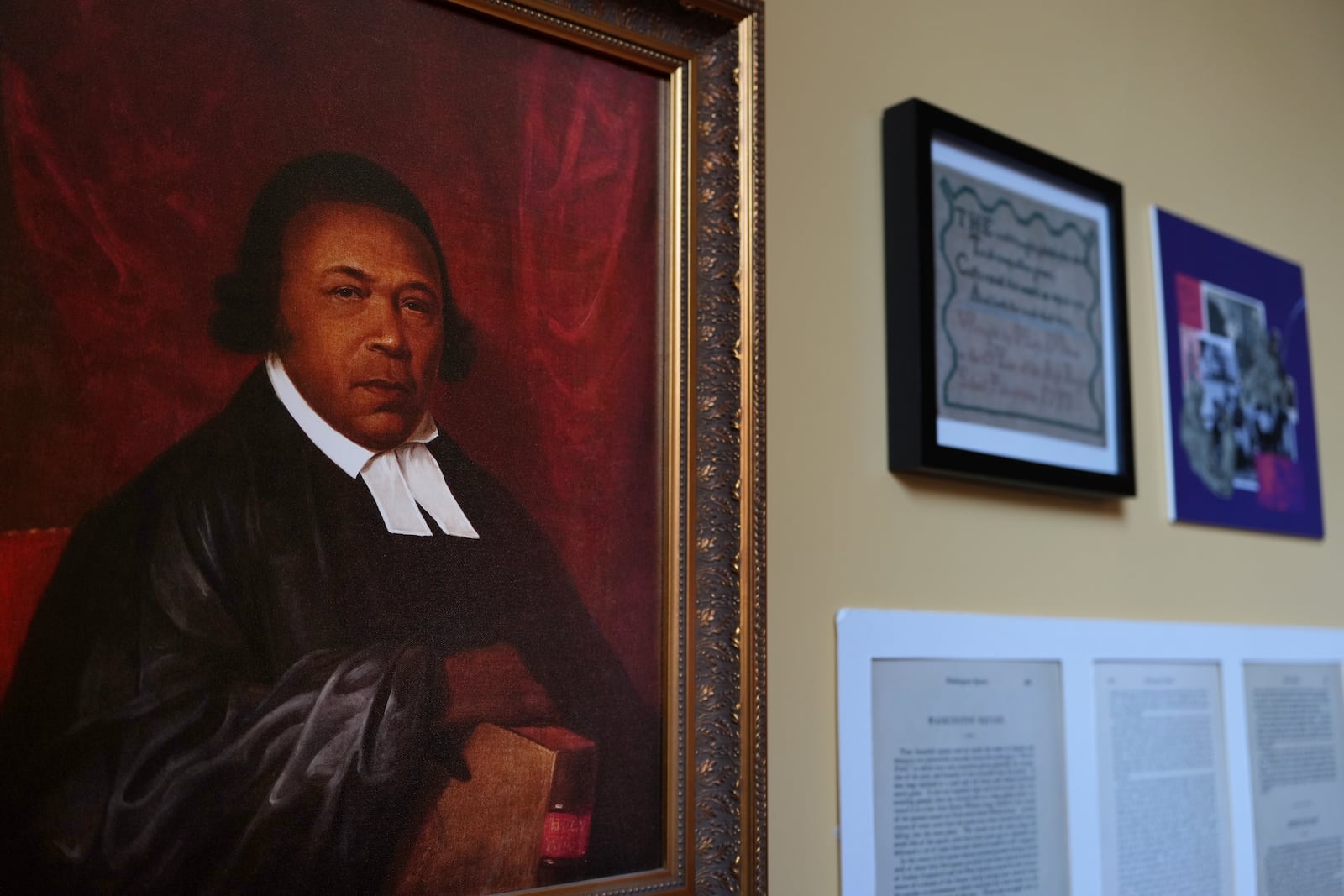 A framed portrait of the Rev. Absalom Jones, who became ordained as the first Black priest of the Episcopal church, is displayed at the Christ Church Neighborhood House in Philadelphia on Sunday, Oct. 6, 2024. (AP Photo/Luis Andres Henao)