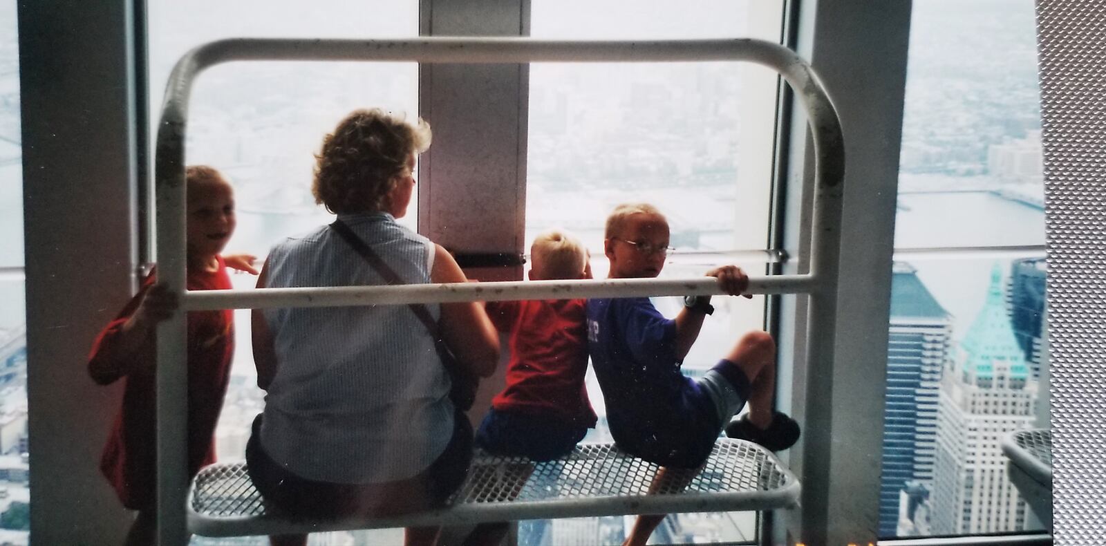 Philip Denlinger of Miamisburg and his family visited the World Trade Center’s observation deck just five weeks before the 9/11 attack. Pictured here high above Manhattan are his wife, Lisa, and sons left to right, Andrew, John and Chip. SUBMITTED